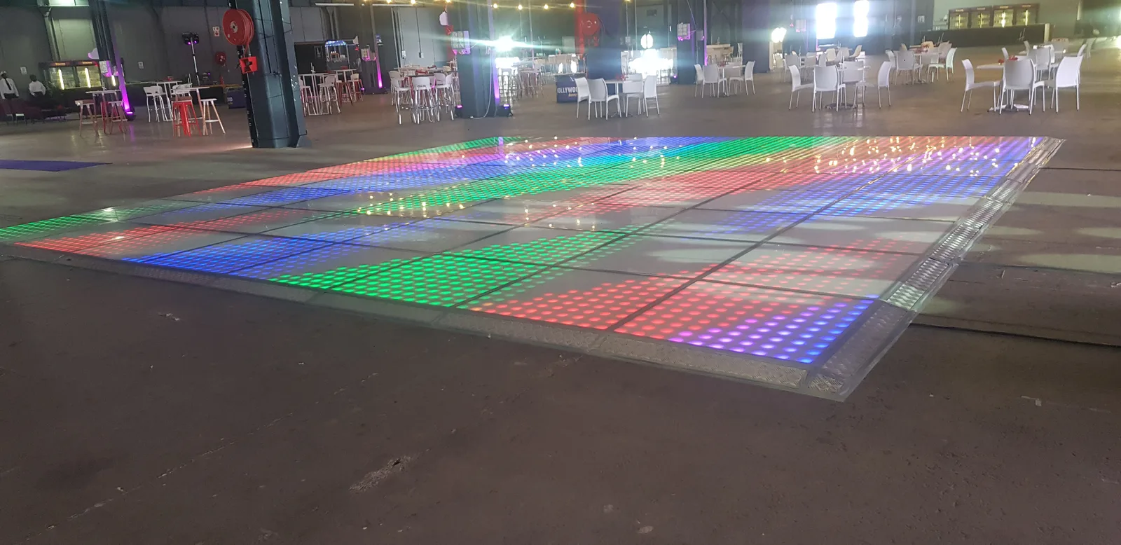 Large multicolour LED floor installed in a spacious event hall